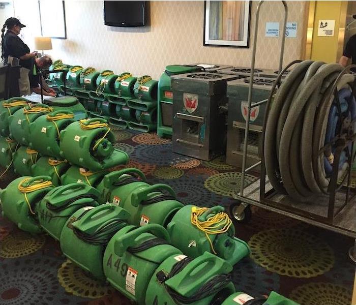 water damage equipment stacked in a hotel lobby